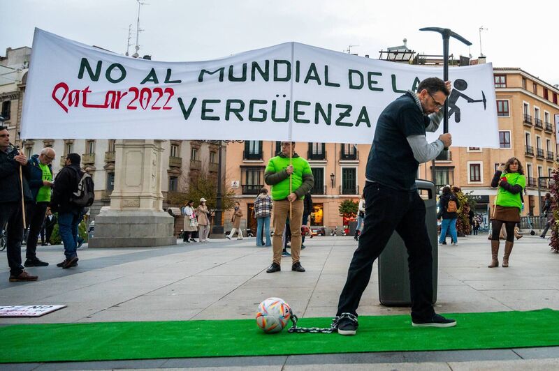 A man is seen in Madrid with a pick and chained to a football ball during a protest against the World Cup. People gathered to protest under the slogan 'No to the World Cup of shame' denouncing that in the construction of infrastructures at least 6,500 immigrant workers are believed to have died. Picture: Marcos del Mazo/LightRocket via Getty Images