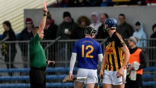 <p>SENT OFF: Cathal O’Connor of Ballyea looks on as Conor Cahalane, 12, of St Finbarr’s is shown a red card by referee Michael Kennedy during the AIB Munster GAA Hurling Senior Club Championship semi-final at Cusack Park in Ennis. Pic: Daire Brennan/Sportsfile</p>