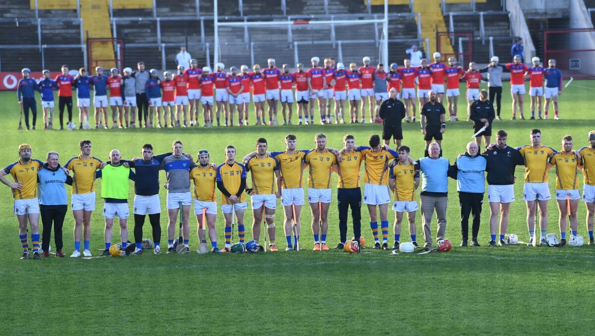 RESPECT: Erins Own (top) and Kilshannig players observe a minute's silence for the late Michael Ellard, Irish Examiner and Echo reporter before the Co Op Superstores Cork JAHC final at Páirc Ui Chaoimh on Sunday. Picture; Eddie O'Hare