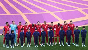 <p>Soccer Football - FIFA World Cup Qatar 2022 - Group B - England v Iran - Khalifa International Stadium, Doha, Qatar - November 21, 2022 Iran players line up during the national anthems before the match REUTERS/Marko Djurica</p>