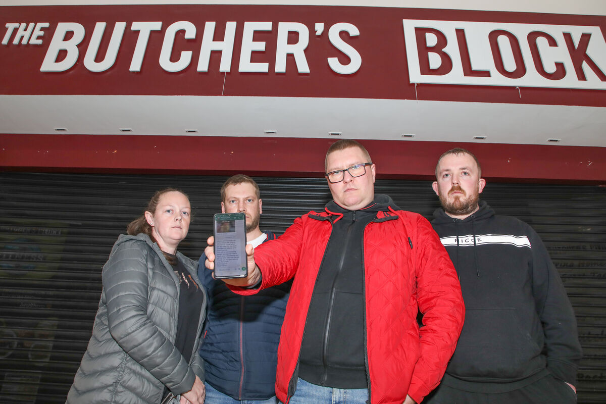 Marek Swiniarski shows the text message he received telling him Butcher's Block at Blackpool Shopping Centre was closing down with other staff members, Tracey Doyle, Mindaugas Matijosius, and Podge O'Donoghue. Picture: David Creedon