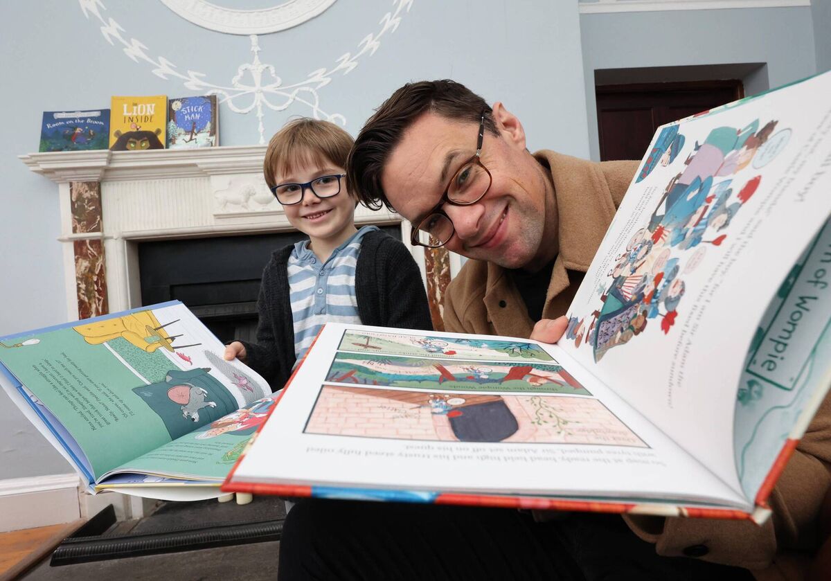 Niall Breslin and a young reader with one of his books 