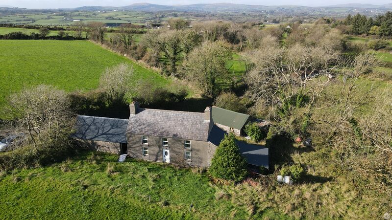 The 39-acre farm near Skibbereen includes a traditional farmhouse and some old stone outbuildings. The 39-acre farm near Skibbereen includes a traditional farmhouse and some old stone outbuildings.