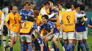 <p>ECSTACY: Japan's Ao Tanaka (centre) celebrates victory over Germany. Pic: Mike Egerton/PA Wire.</p>
