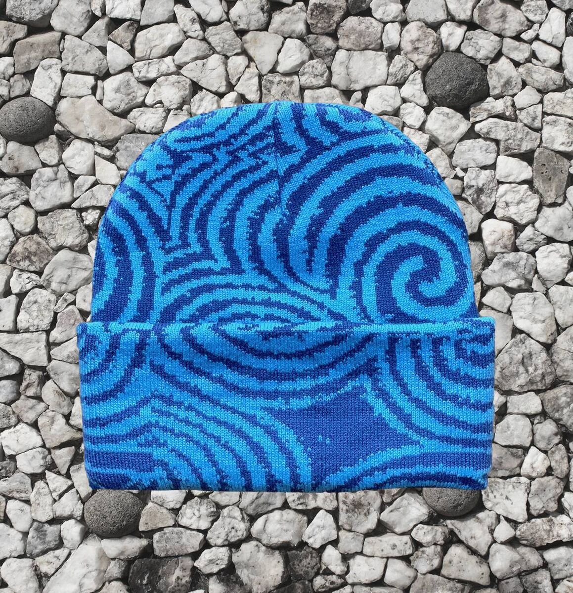 A look at one of Execute Exist's new beanies, inspired by spiral carvings at Newgrange A look at one of Execute Exist's new beanies, inspired by spiral carvings at Newgrange