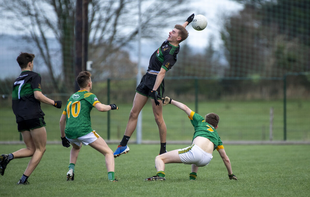 REACH: Timmy Moynihan, St Brendans, Killarney and Ben Murphy Mercy Mounthawk, Tralee (Black) in action at Milltown,