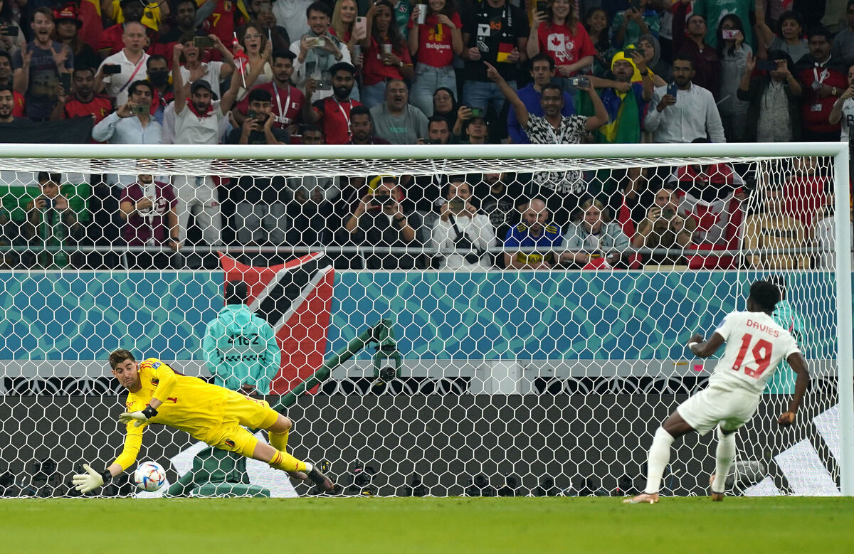 GOLDEN OPPORTUNITY: Canada's Alphonso Davies has a penalty saved by Belgium goalkeeper Thibaut Courtois. Pic: Mike Egerton/PA Wire.