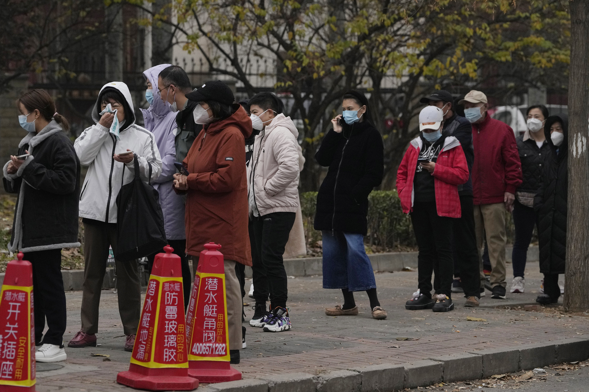 China expands lockdowns as Covid-19 cases hit daily record