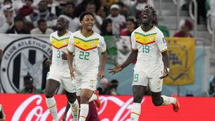 <p>JOY UNCONFINED: Senegal’s Famara Diedhiou, right, celebrates after scoring his side’s second goal against World Cup hosts Qatar. Pic: Thanassis Stavrakis/AP</p>