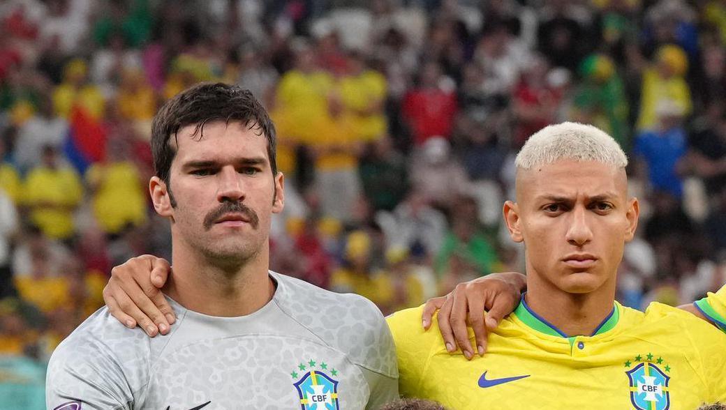 TEAM SPIRIT: Brazil players Alisson and Richarlison. Pic: Nick Potts/PA Wire.
