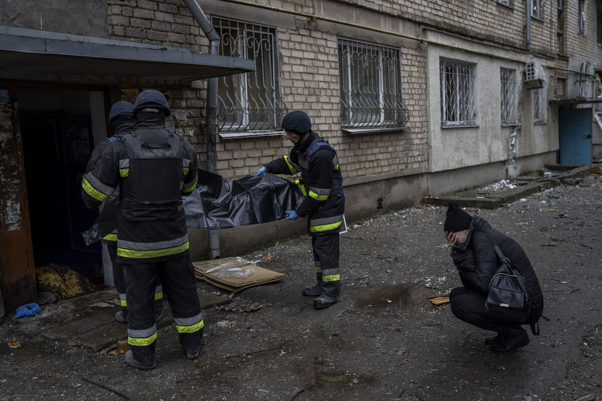 Lilia Kristenko, 38, cries as city responders collect the dead body of her mother Natalia Kristenko in Kherson, southern Ukraine, on Friday. Picture: AP Photo/Bernat Armangue Lilia Kristenko, 38, cries as city responders collect the dead body of her mother Natalia Kristenko in Kherson, southern Ukraine, on Friday. Picture: AP Photo/Bernat Armangue