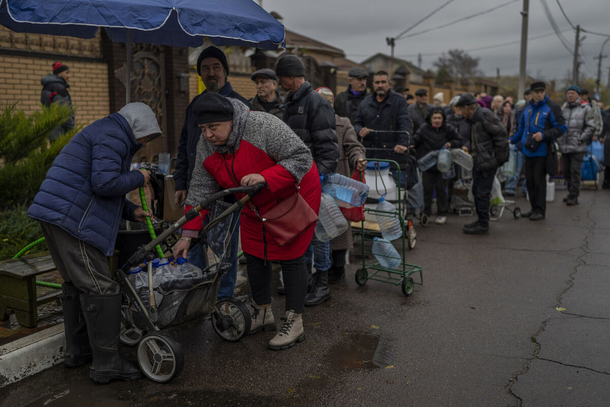 Residents queue to fill containers with drinking water in Kherson, southern Ukraine on Sunday. Picture: AP Photo/Bernat Armangue Residents queue to fill containers with drinking water in Kherson, southern Ukraine on Sunday. Picture: AP Photo/Bernat Armangue