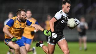 <p>KILCOO's Ryan Johnston breaks clear of Richard O'Callaghan of Enniskillen in the Ulster Club SFC semi-final Saturday night at the Athletic Grounds in Armagh. </p>