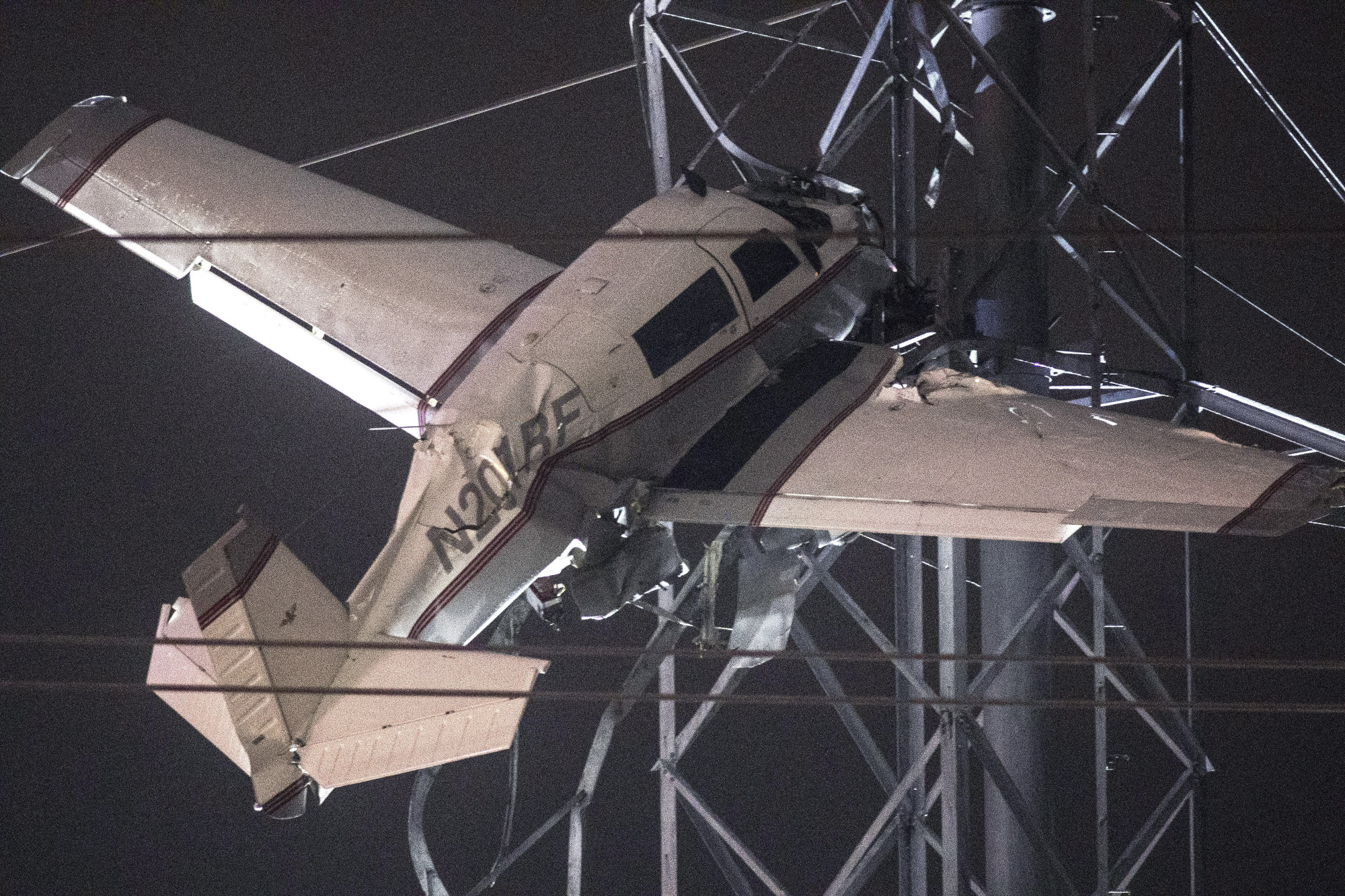 Two rescued from plane caught in power lines
