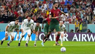<p>ON THE SPOT: Portugal's Bruno Fernandes scores his side's second goal from the penalty spot during the World Cup Group H game against Uruguay. Pic: AP Photo/Petr David Josek</p>
