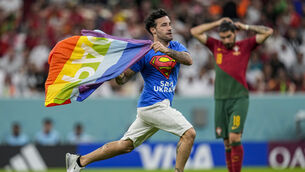<p>Mario Ferri, who ran across the pitch with a rainbow flag during the Portugal v Uruguay match has been banned from attending all of the remaining World Cup games (Abbie Parr/AP)</p>