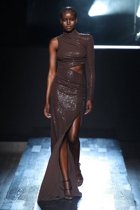 Adut Akech walks the runway during Michael Kors Collection Fall/Winter 2022 Runway Show at Terminal 5 on February 15, 2022 in New York City. (Photo by JP Yim/Getty Images for Michael Kors)