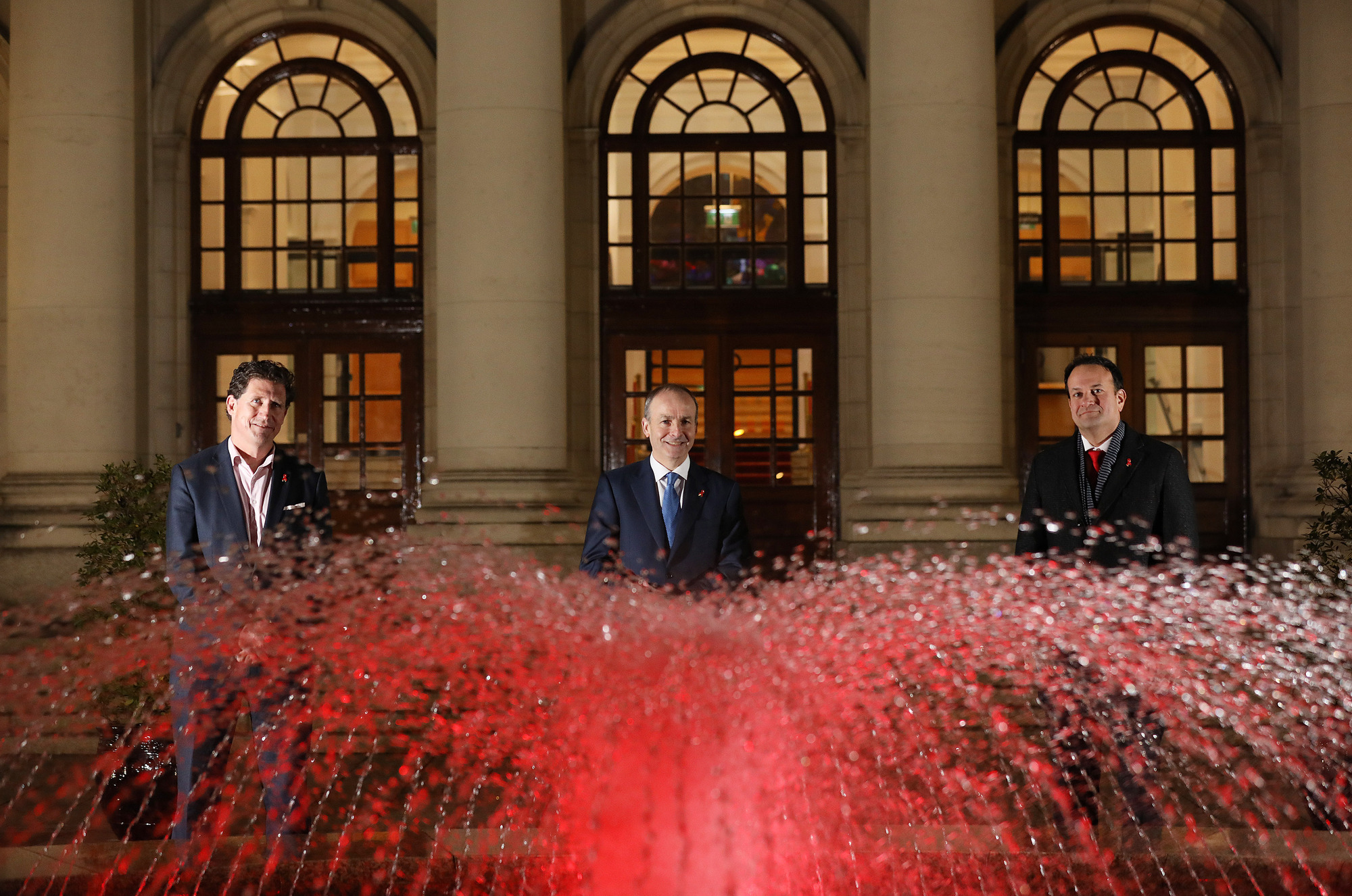 The fountain at Government buildings was illuminated in red to mark World Aids Day in 2020. Picture: Julien Behal 