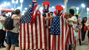 <p>STARS AND STRIPES: USA fans gather outside the stadium ahead of thegame against Iran. Picture: Photo by Simon Bruty/Anychance/Getty Images</p>