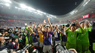 <p>Japan's Maya Yoshida celebrates with teammates after the final whistle. Picture: Nick Potts/PA Wire.</p>