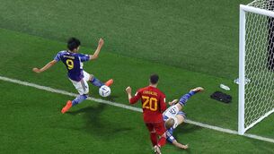 <p>GAME OF INCHES: Japan's Kaoru Mitoma crosses the ball for his team's second goal. Picture: GIUSEPPE CACACE/AFP via Getty Images</p>
