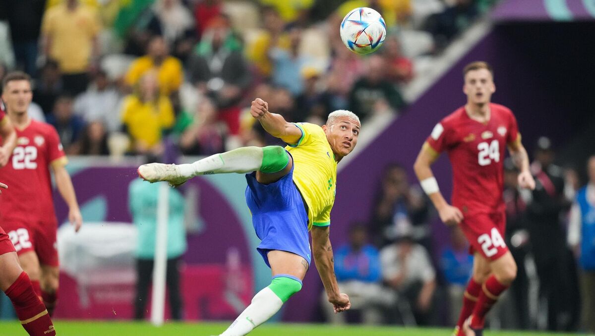 HIGH FLIER: Brazil’s Richarlison scores one of the goals of the tournament so far against Serbia. Picture: Peter Byrne/PA Wire.