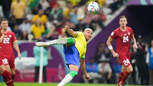 <p>HIGH FLIER: Brazil’s Richarlison scores one of the goals of the tournament so far against Serbia. Picture: Peter Byrne/PA Wire.</p>