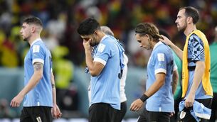 <p>DISCONSOLATE: Uruguay’s Luis Suarez , 2nd from left, cries after the World Cup group H soccer match between Ghana and Uruguay, at the Al Janoub Stadium in Al Wakrah, Qatar. Pic: AP Photo/Manu Fernandez</p>