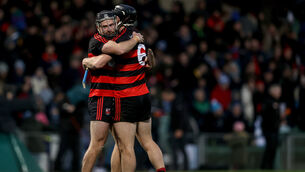 <p>JOB DONE: Ballygunner's Ian Kenny celebrates after the final whistle with Philip Mahony </p>