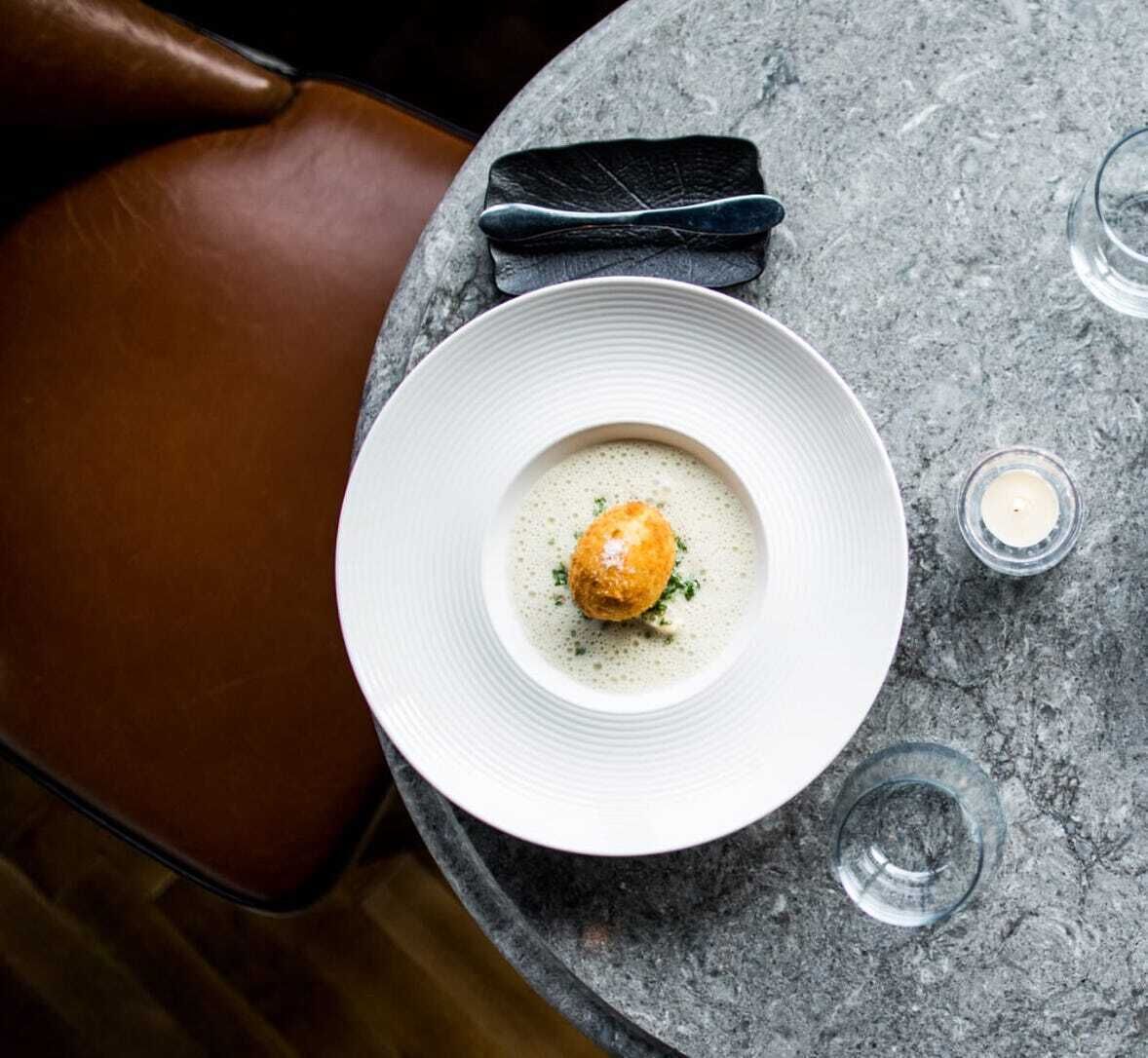 Warmed smoked haddock in silky potato veloutĆ©, with soft boiled crisped henās egg at Cush Warmed smoked haddock in silky potato veloutĆ©, with soft boiled crisped henās egg at Cush