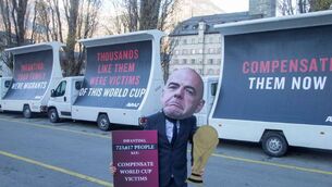 <p>PROTEST: An activist wears a portrait of FIFA President Gianni Infantino during a protest of social movement group AVAAZ, to demand the world soccer body to compensate migrant workers for alleged human rights abuses in Qatar, host of the football World Cup, in his hometown Brig, Switzerland. Pic: REUTERS/Arnd Wiegmann</p>