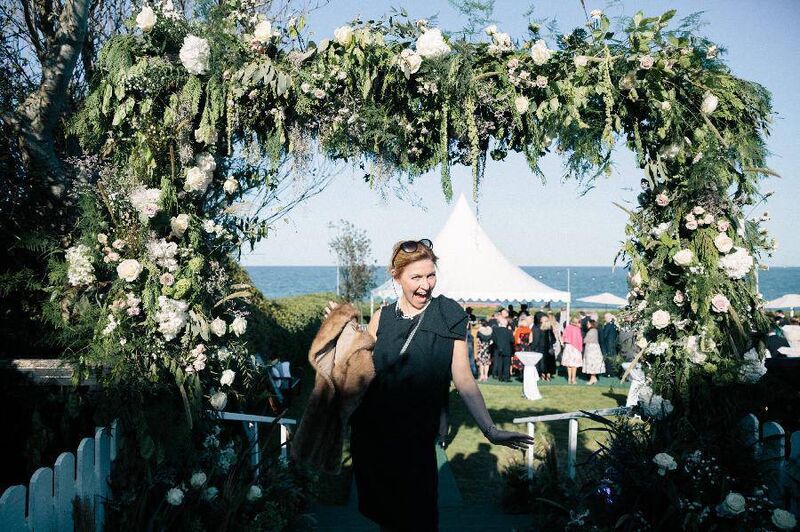 Tara Fay bringing a guest's coat to the cloakroom at a pre-pandemic outdoor wedding. Picture: Doreen Kilfeather