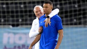 <p>ALL SMILES: France's Kylian Mbappe and manager Didier Deschamps during a training session at the Al Sadd Sports Club in Doha, Qatar. Pic: Peter Byrne/PA Wire</p>