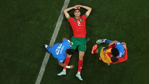 <p>FLOORED IN DISBELIEF: Achraf Hakimi savours the moment after Morocco’s stunning quarter-final win over Portugal secured a slice of World Cup history for the African outfit. Pic: Lars Baron/Getty Images</p>