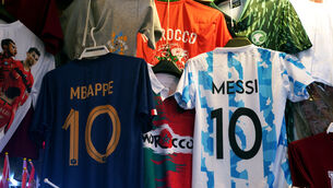 <p>A France and Argentina shirt hang in a market stall in the Souq area of Doha. Reigning champions France will play Argentina in Sunday�s World Cup final. Picture date: Saturday December 17, 2022.</p>