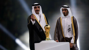 <p>Emir of Qatar, Sheikh Tamim bin Hamad Al Thani (left) with the World Cup Trophy ahead of the presentation to Argentina's Lionel Messi following the FIFA World Cup final at Lusail Stadium, Qatar. Picture date: Sunday December 18, 2022. PA Photo. See PA story WORLDCUP Final. Photo credit should read: Mike Egerton/PA Wire.</p>