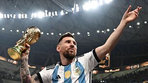 <p>FINALLY: Lionel Messi with the biggest prize of his long and illustrious career. Pic: Anne-Christine Poujoulat/AFP via Getty Images</p>