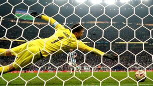<p>Argentina's Lionel Messi effortlessly puts the ball past French goalkeeper Hugo Lloris during the penalty shootout that decided the Fifa World Cup final at Lusail Stadium, Qatar yesterday. Picture: Nick Potts/PA</p>