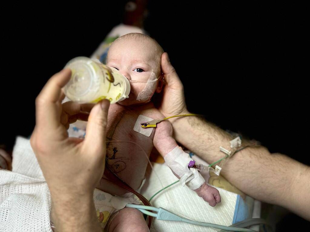 Baby David's first ever bottle, at 4 days old Baby David's first ever bottle, at 4 days old