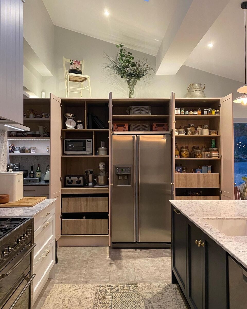 The pantry cupboard bank in Sharon Holland's kitchen includes a tea and coffee station where all the necessary equipment is in one space, with a mixture of shelving and drawer storage. The pantry cupboard bank in Sharon Holland's kitchen includes a tea and coffee station where all the necessary equipment is in one space, with a mixture of shelving and drawer storage.