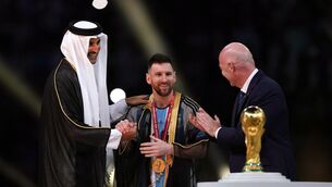 <p>Emir of Qatar, Sheikh Tamim bin Hamad Al Thani dresses Argentina's Lionel Messi with traditional Arab bisht ahead of the trophy presentation.</p>