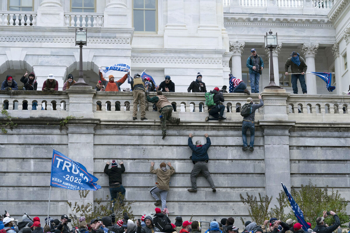 Trump supporters climb the west wall of the the US Capitol. Picture: AP Photo/Jose Luis Magana