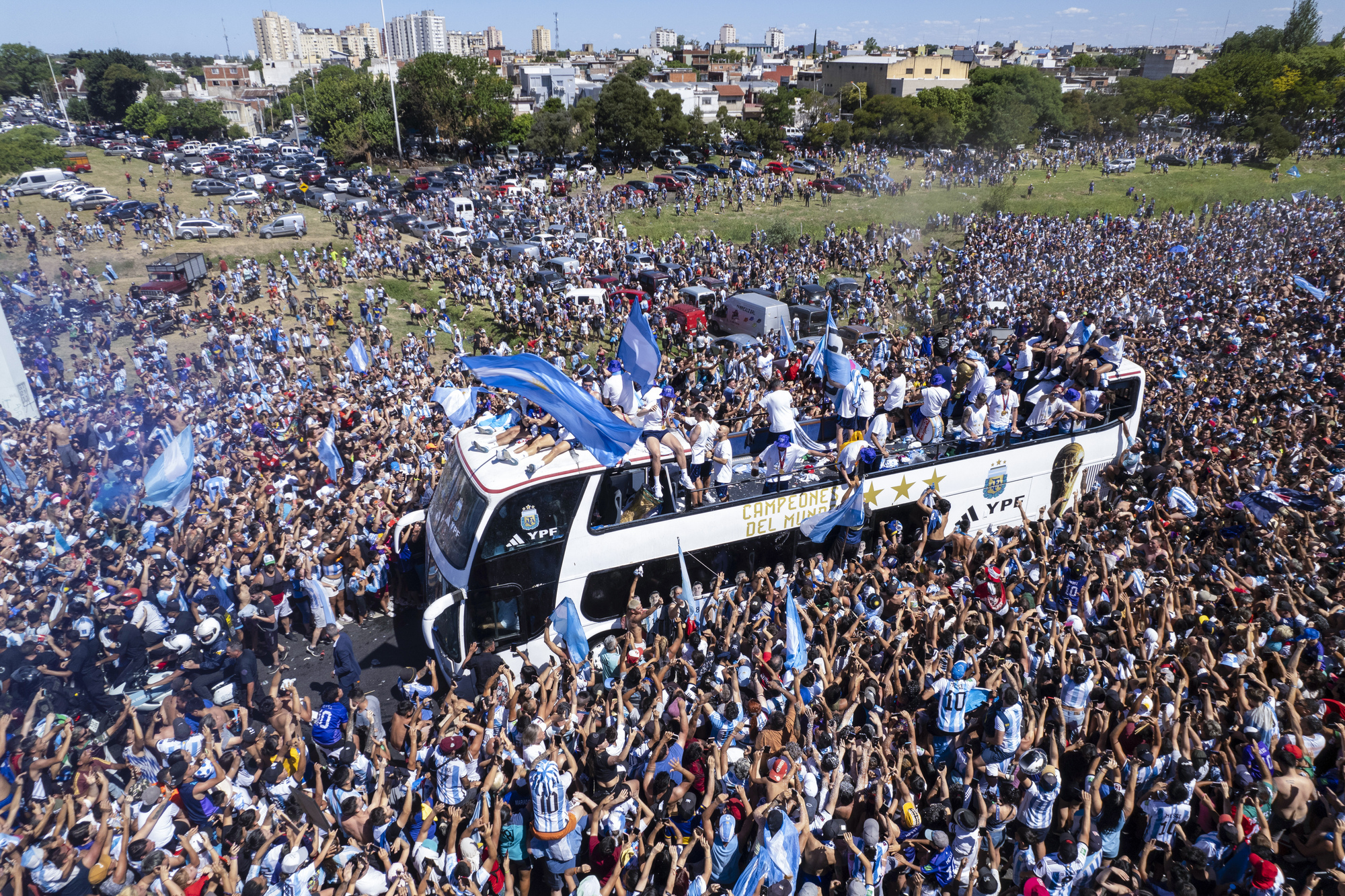 Argentina forced to swap bus for helicopters as fans swarm streets during parade