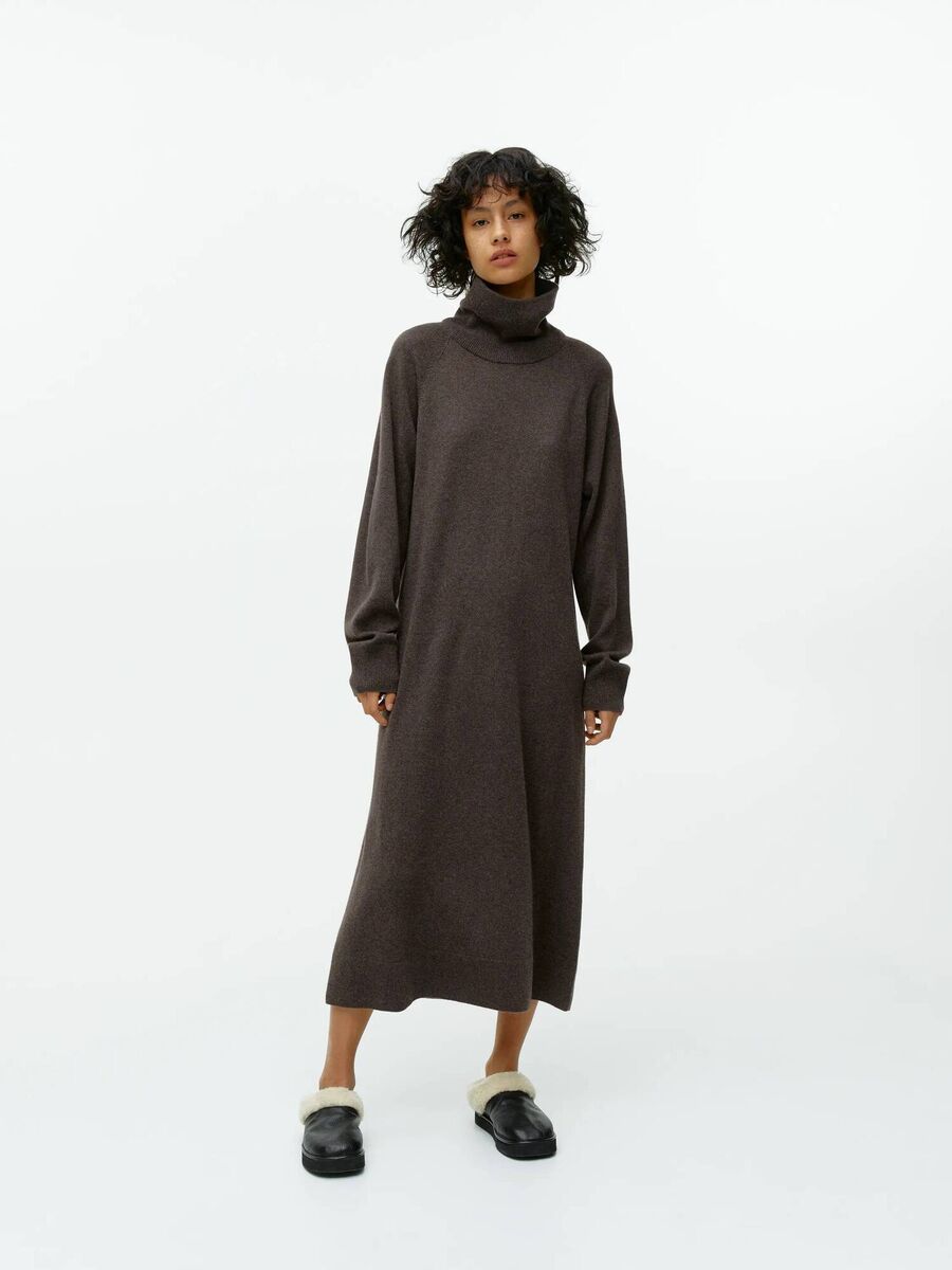 Cashmere roll neck dress, €250; leather pile slippers, €129, Arket