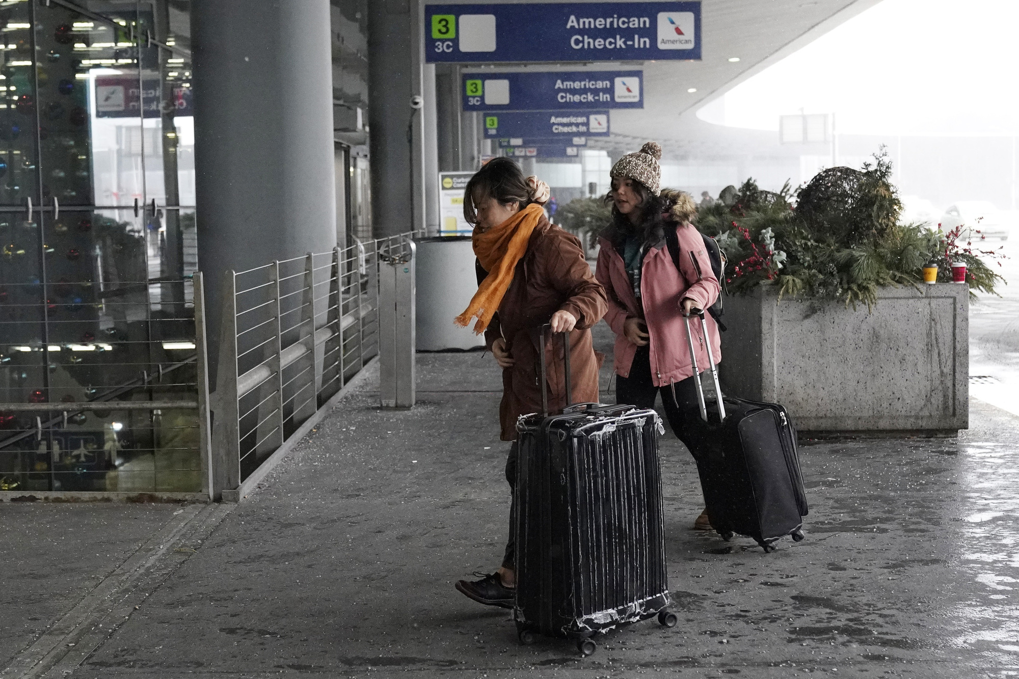Holiday travel upended in the US as forecasters warn of ‘bomb cyclone’