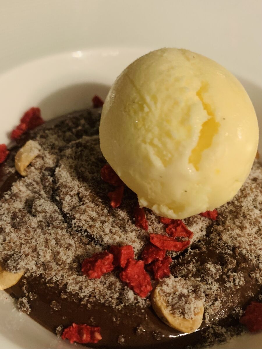 Hot dark chocolate mousse with a rather fine sheep milk ice cream Hot dark chocolate mousse with a rather fine sheep milk ice cream