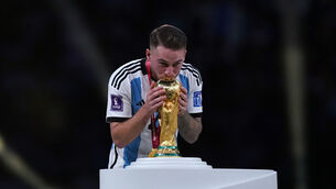 <p>SEALED WITH A KISS: Argentina's Alexis Mac Allister kisses the World Cup trophy before the ceremony following FIFA World Cup final at Lusail Stadium, Qatar. Picture date: Sunday December 18, 2022. PA Photo. See PA story WORLDCUP Final. Photo credit should read: Mike Egerton/PA Wire.</p>