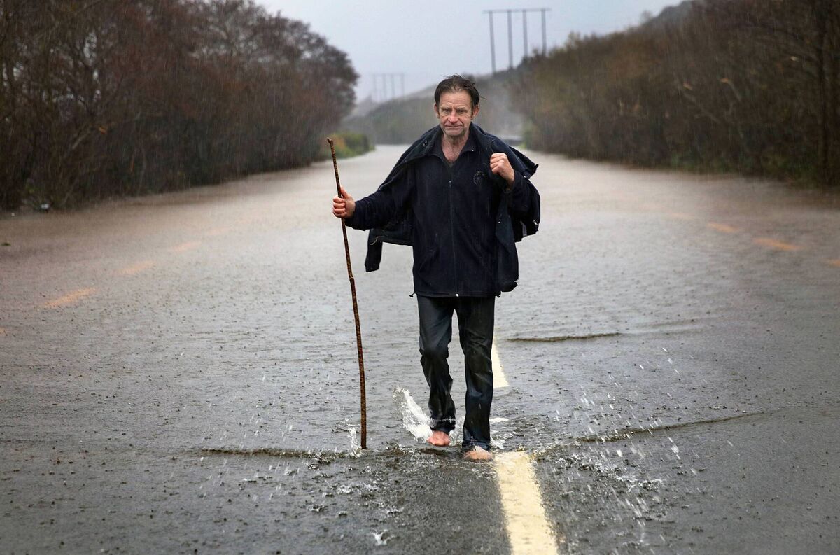 The Late Johnny 'The Rock' O'Brien, heading back to his flooded house after rescuing his sheep and guiding them to higher ground, during Storm Desmond in Glenflesk, Co Kerry. Photo:Valerie O'Sullivan