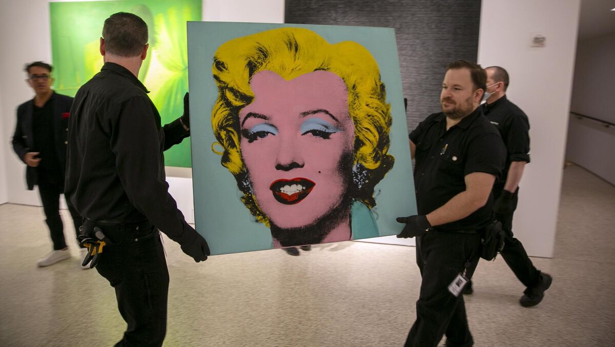 The 1964 painting Shot Sage Blue Marilyn by Andy Warhol is carried in Christie's showroom in New York City. The 1964 painting Shot Sage Blue Marilyn by Andy Warhol is carried in Christie's showroom in New York City.