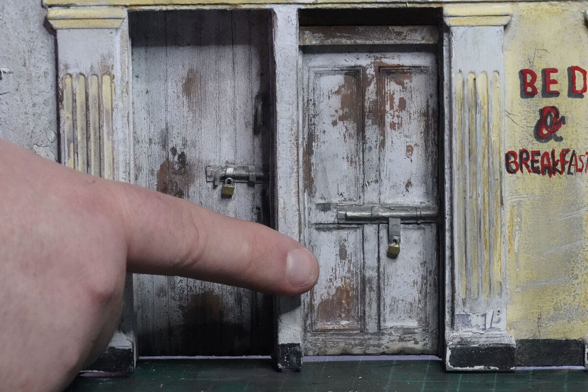 Model Maker Nathan Wheeler who is exposing the large number of derelict properties across Ireland by creating detailed models of the buildings, at his studio in Dublin. PIC: Niall Carson/PA Wire